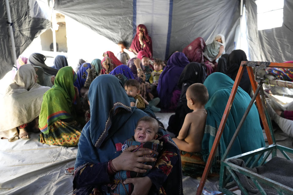 Women sit in a makeshift shelter after an earthquake in Gayan village, in Paktika province, Afghanistan, Friday, June 24, 2022. A powerful earthquake struck a rugged, mountainous region of eastern Afghanistan early Wednesday, flattening stone and mud-brick homes in the country's deadliest quake in two decades, the state-run news agency reported. (AP Photo/Ebrahim Nooroozi)