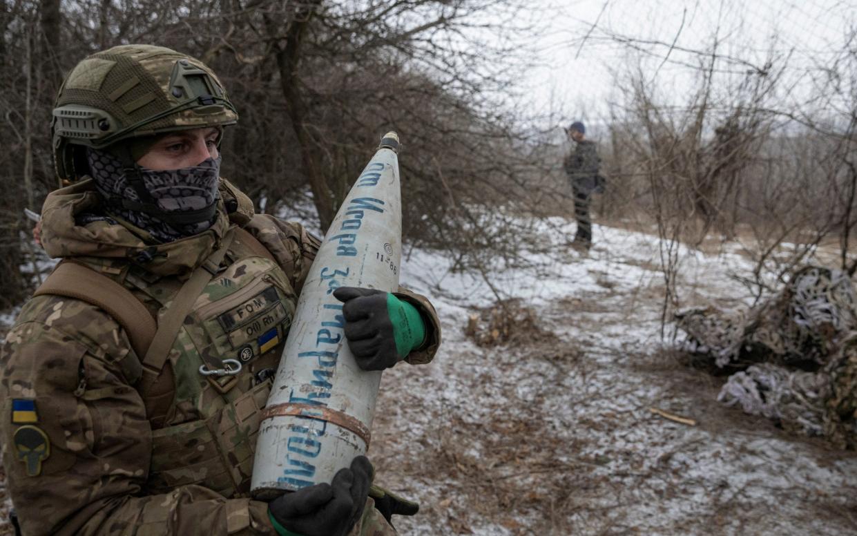 A member of the 3rd Separate Assault Brigade of the Armed Forces of Ukraine prepares to fire 152 mm howitzer 2A65 Msta-B, near Bahmut - Reuters