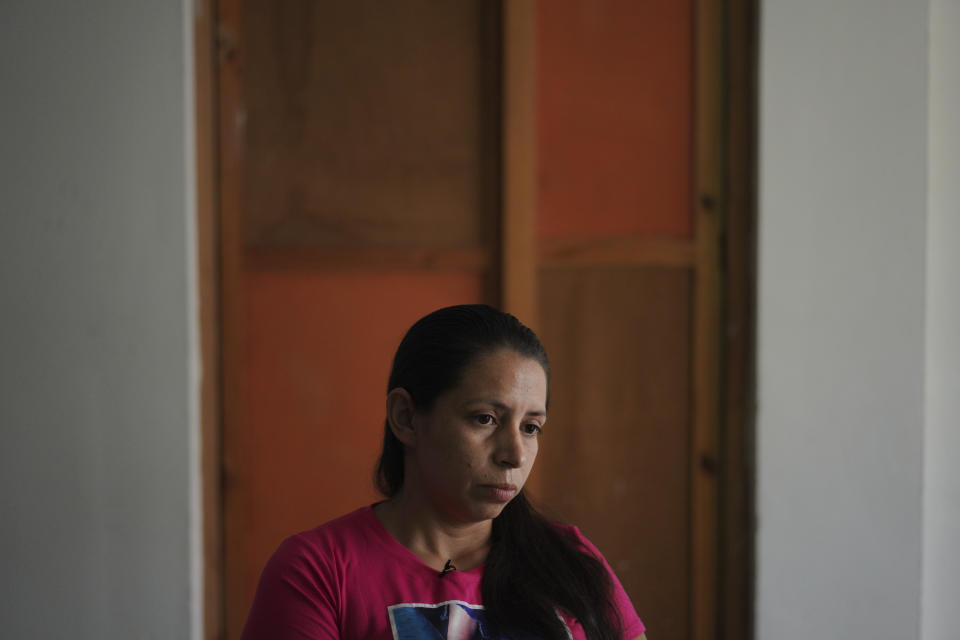 Karen, who was convicted of aggravated homicide for allegedly terminating her pregnancy, sits for an interview in San Salvador, El Salvador, on Tuesday, May 17, 2022. At 21, she fainted while having an obstetric emergency alone at her grandmother’s home. She woke up at the hospital handcuffed to a gurney and was later sentenced to 30 years. After spending seven years in prison, the Citizen Group for the Decriminalization of Abortion and other activists successfully advocated for her release this past December. (AP Photo/Jessie Wardarski)