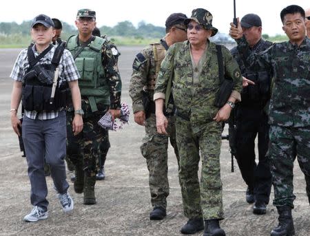 Philippine President Rodrigo Duterte (C) arrives at the military camp in Marawi city, southern Philippines July 20, 2017. Malacanang presidential palace/Handout via Reuters