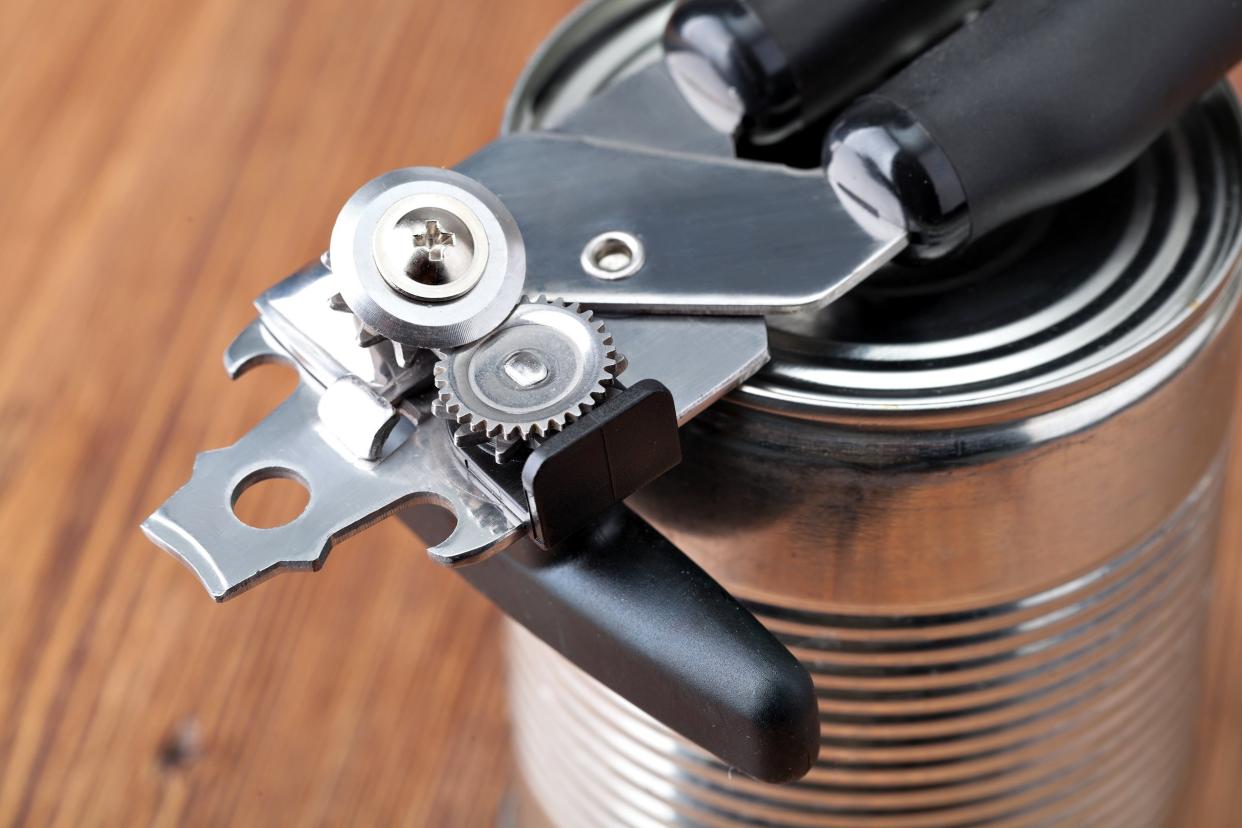 tin opener opening a can