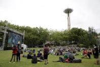 People gather near the Space Needle to watch a live feed of The International Dota 2 Championships at Key Arena in Seattle, Washington August 8, 2015. REUTERS/Jason Redmond