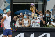 Rafael Nadal of Spain is watched by fans during a practice session at Melbourne Park at the Australian Open tennis championships in Melbourne, Australia, Saturday, Jan. 29, 2022. Nadal will play Russia's Daniil Medvedev on Sunday Jan. 30 in the men's singles final. (AP Photo/Mark Baker)