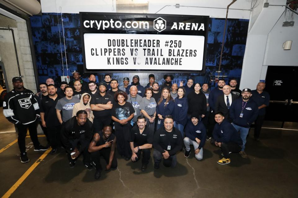 Employees at the Crypto.com Arena gather for a team photo
