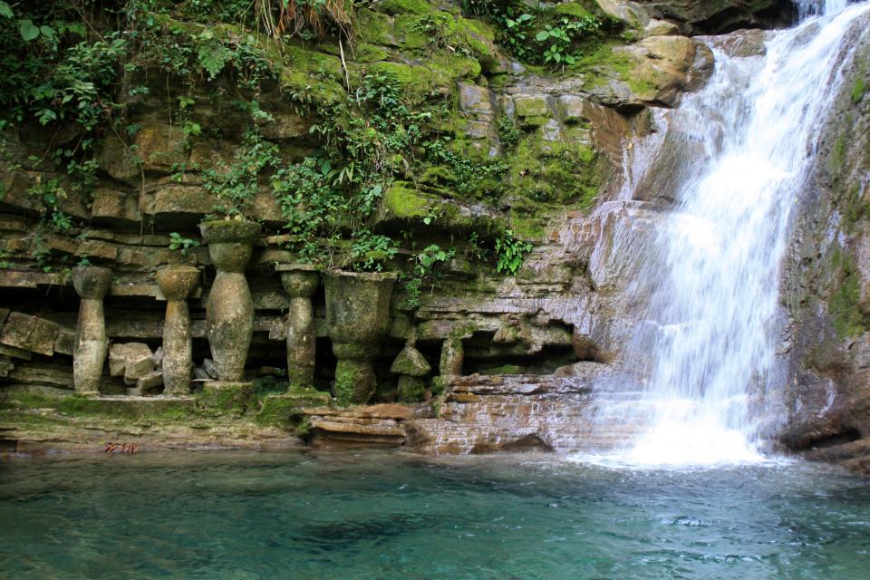 In this Feb. 1, 2014 photo, a natural waterfall flows down a rock wall in Las Pozas, a dreamy, little-known garden of surreal art, in Mexico’s northeast jungle. The garden was created by the late Edward James, a British multimillionaire and arts patron who favored surrealists like Rene Magritte and Salvador Dali. (AP Photo/Teresa de Miguel Escribano)