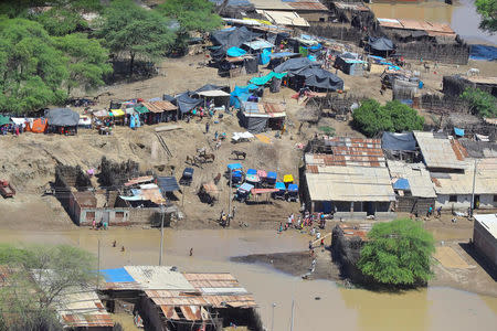 Aerial view of flooded streets as Peru's President Pedro Pablo Kuczynski inspects floods from a helicopter in Piura, northern Peru, March 28, 2017. Luis Guillen/Presidential Palace/Handout via Reuters