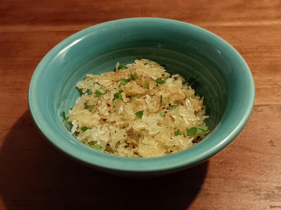 Crispy rice in a blue-green bowl