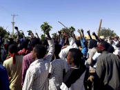 FILE - In this Sunday, Dec. 23, 2018 file handout image, provided by a Sudanese activist, people chant against the government during a protest in Kordofan, Sudan. With violent anti-government protests into their fourth week, Sudan appears headed toward political paralysis, with drawn out unrest across much of the country and a fractured opposition without a clear idea of what to do if their wish to see the country’s leader of 29 years go comes true. (Sudanese Activist via AP, File)