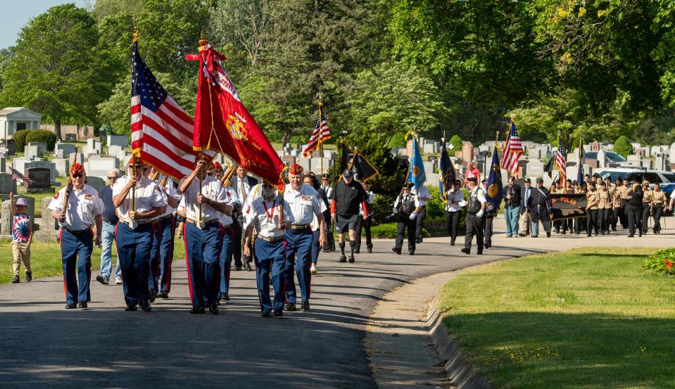 The Marine Corps League Worcester Detachment 144 leads a parade through Hope Cemetery to the city’s Memorial Day ceremony Monday.