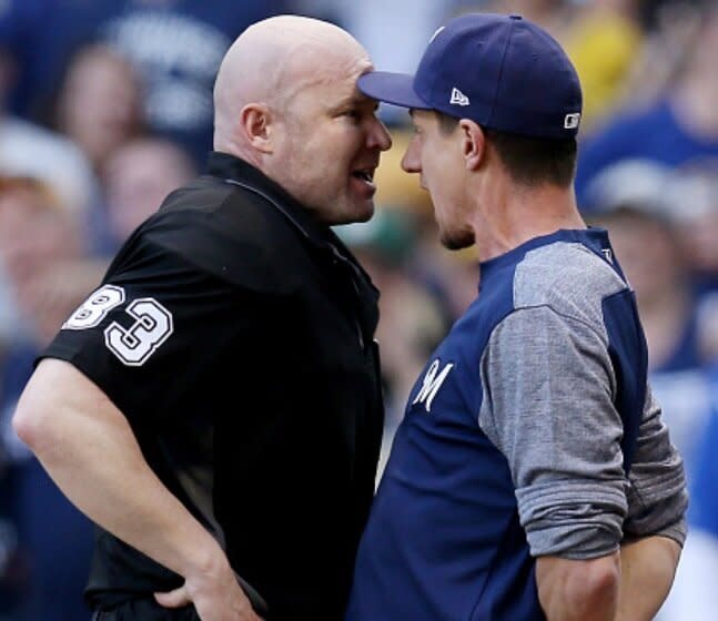 Manager Craig Counsell goes 'head-to-head' with umpire Mike Estabrook over missed calls and ejections in Brewers loss. (Getty Images)