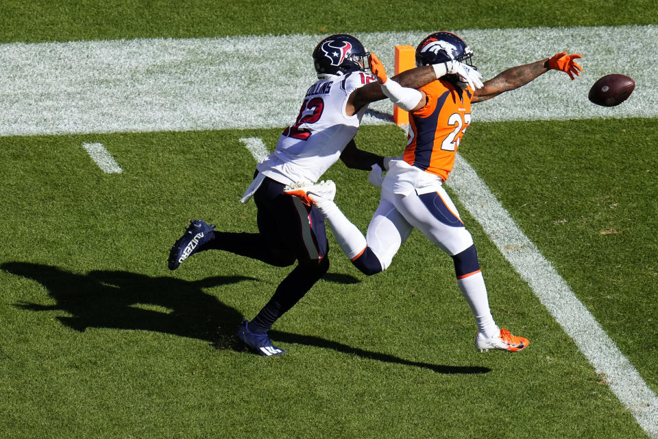 Denver Broncos cornerback Ronald Darby (23) breaks up a pass intended for Houston Texans wide receiver Nico Collins (12) during the first half of an NFL football game, Sunday, Sept. 18, 2022, in Denver. (AP Photo/Jack Dempsey)