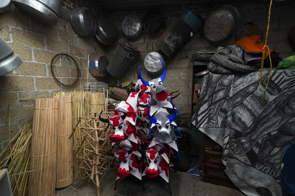Paper-mache bulls to be stuffed with fireworks are stored in a warehouse ahead of the annual festival honoring Saint John of God, the patron saint of the poor and sick whom fireworks producers view as a protective figure, in Tultepec, Mexico, Thursday, March 7, 2024. (AP Photo/Marco Ugarte)