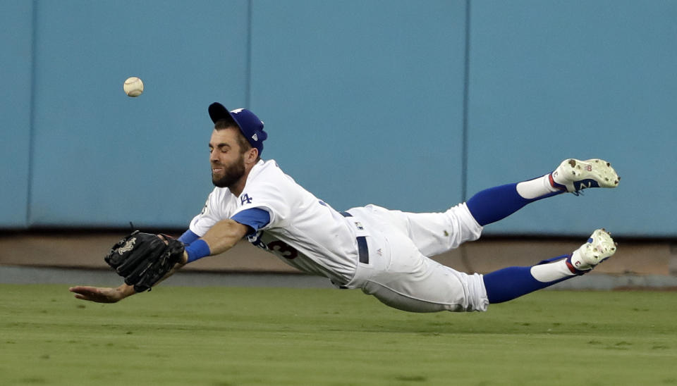 <p>Los Angeles Dodgers center fielder Chris Taylor can’t get a glove on a RBI-single by Houston Astros’ Alex Bregman during the third inning of Game 2 of baseball’s World Series Wednesday, Oct. 25, 2017, in Los Angeles. (AP Photo/Matt Slocum) </p>