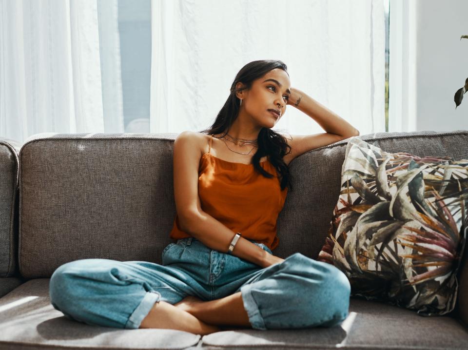 A woman sitting on the sofa.