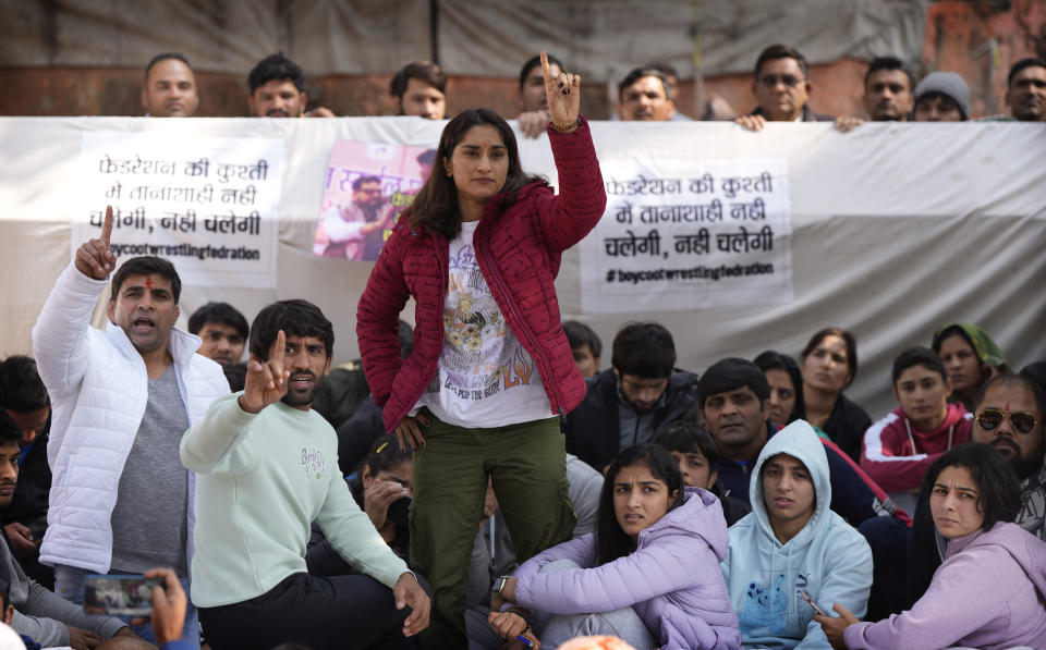 Bajrang Punia, Indian wrestler who won a Bronze medal at the 2020 Tokyo Olympics, second left, participates with other wrestlers in a protest against Wrestling Federation of India President Brijbhushan Sharan Singh and other officials in New Delhi, India, Friday, Jan. 20, 2023. Top Indian wrestlers on Saturday called off a sit-in protest near the parliament building following a government assurance that a probe into their allegations of sexual harassments of young athletes by the federation would be completed in four weeks. (AP Photo/Manish Swarup)