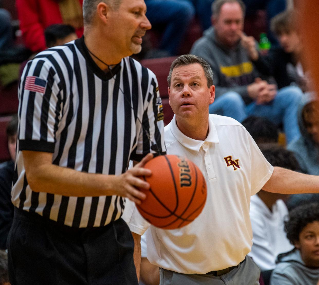 Bloomington North head coach Jason Speer questions a call during the Bloomington North versus Center Grove boys basketball game at Bloomington High School North on Friday, Dec. 2, 2022.