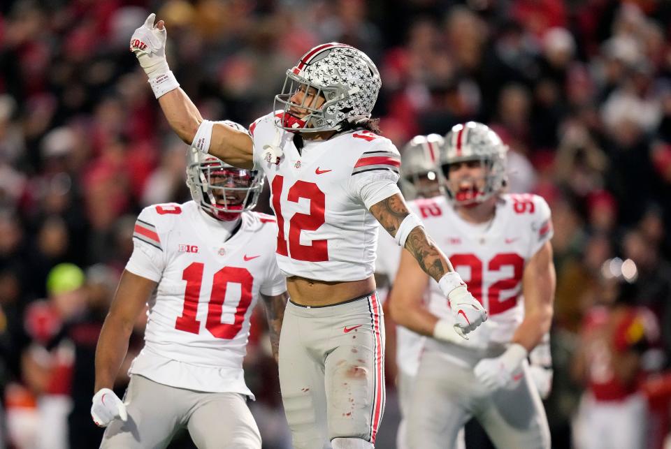 Nov 19, 2022; College Park, MD, USA; Ohio State Buckeyes safety Lathan Ransom (12) celebrates after blocking a Maryland Terrapins punt in the third quarter in their Big Ten game at SECU Stadium. 