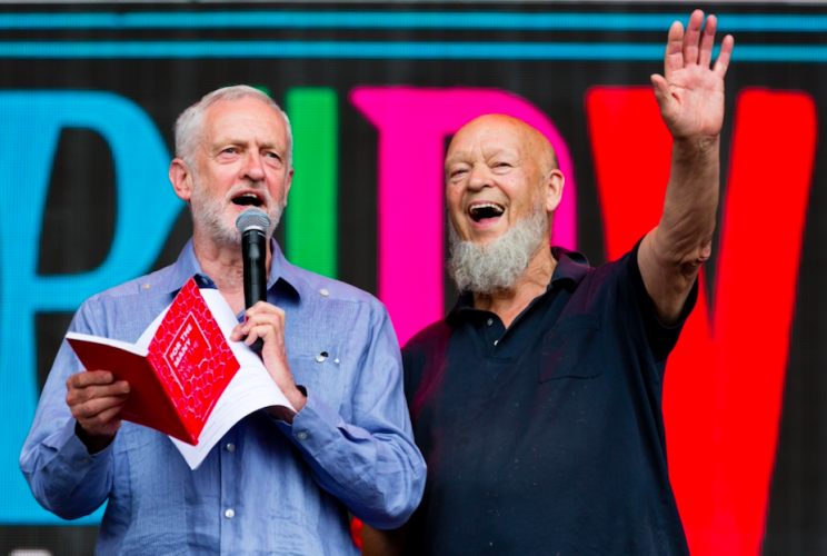 Jeremy Corbyn and Michael Eavis drew rapturous applause at Glastonbury (REX)