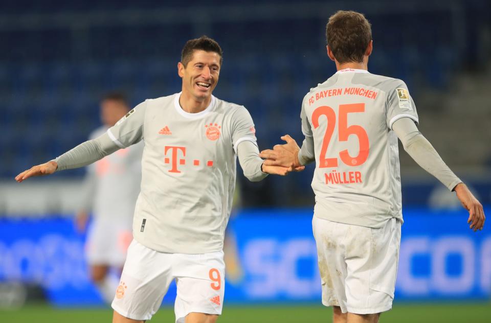 Soccer Football - Bundesliga - Arminia Bielefeld v Bayern Munich - Bielefelder Alm, Bielefeld, Germany - October 17, 2020 Bayern Munich's Robert Lewandowski celebrates scoring their third goal with Thomas Muller Pool via REUTERS/Wolfgang Rattay DFL regulations prohibit any use of photographs as image sequences and/or quasi-video.