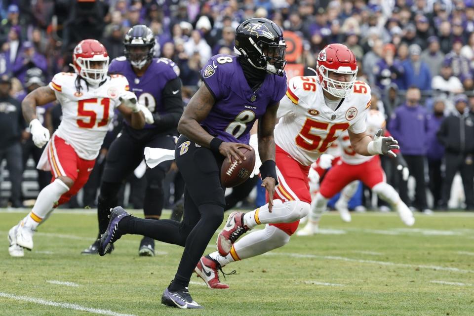 Jan 28, 2024; Baltimore, Maryland, USA; Baltimore Ravens quarterback Lamar Jackson (8) runs with the ball during the first quarter in the AFC Championship football game against the Kansas City Chiefs at M&T Bank Stadium. Mandatory Credit: Geoff Burke-USA TODAY Sports