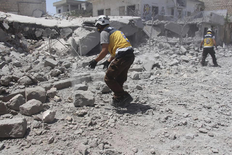 CORRECTS DATE TO MONDAY JUNE 3 -- This photo posted and provided by the Syrian Civil Defense White Helmets, which has been authenticated based on its contents and other AP reporting, shows Civil Defense workers searching for victims under the rubble after an airstrike by Syrian government forces hit the village of Ehsim, in Jabal al-Zawiya, some 10 kilometers (6 miles) north of the town of Maarat al-Numan in Idlib, Syria, Monday, June 3, 2019. The Britain-based Syrian Observatory for Human Rights, an opposition war monitor, said on Monday that Syrian troops had reached Qassaibyeh, a village deep within the last rebel stronghold in the northwest province of Idlib, after intense clashes with militants. (Syrian Civil Defense White Helmets via AP)