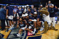 Villanova players pose with the tournament trophy after defeating Creighton in the final of the Big East conference tournament Saturday, March 12, 2022, in New York. (AP Photo/Frank Franklin II)