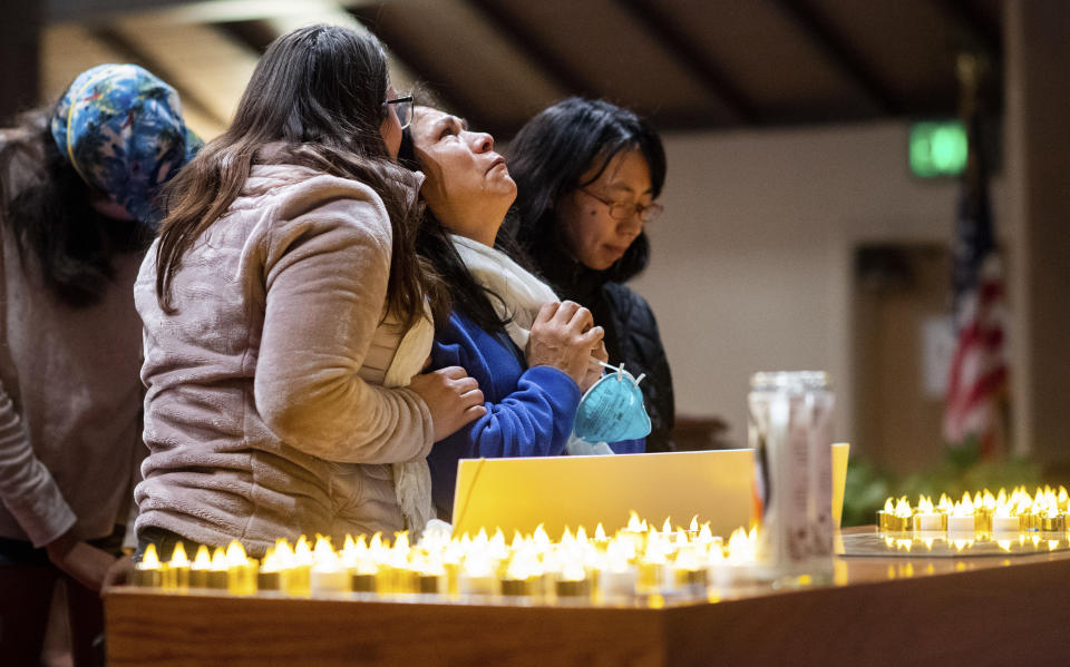 Lidia Steineman, who lost her home in the Camp Fire, prays during a vigil for fire victims on Sunday, Nov. 18, 2018, in Chico, Calif. More than 50 people gathered at the memorial for the victims. People hugged and shed tears as Pastor Jesse Kearns recited a prayer for first responders. (AP Photo/Noah Berger, Pool)