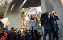 <p>Iranian students clash with riot police during an anti-government protest around the University of Tehran, Iran, Dec. 30, 2017. (Photo: STR/EPA-EFE/REX/Shutterstock) </p>