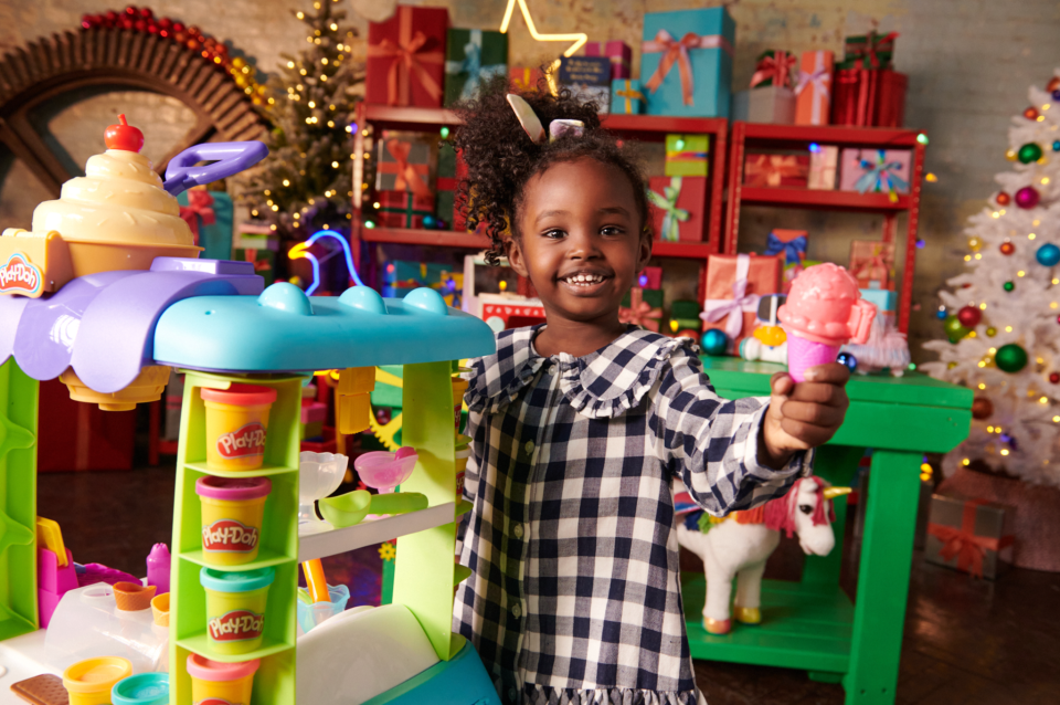 Amani the toy-tester loves the Play-Doh ice cream cart. (Image: John Lewis)