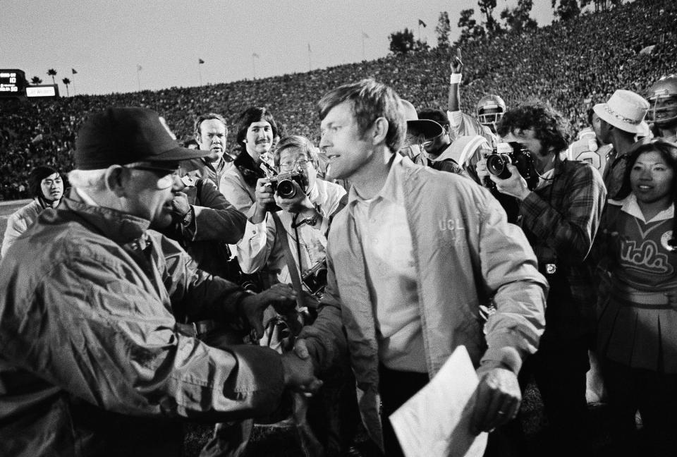 Woody Hayes, left, of Ohio State congratulates UCLA coach Dick Vermeil as the Rose Bowl ended on Jan. 1, 1976 in Pasadena, Calif., with UCLA a 23-10 winner in an upset.