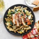 <p>If you love warm spinach and artichoke dip, then you'll love that we turned this classic dip into a creamy pasta dish with chicken. And here's what's almost as good as the flavor of this comforting dish: the fact that this healthy dinner takes just 20 minutes to prepare. <a href="https://www.eatingwell.com/recipe/7910586/spinach-artichoke-dip-pasta-with-chicken/" rel="nofollow noopener" target="_blank" data-ylk="slk:View Recipe;elm:context_link;itc:0;sec:content-canvas" class="link ">View Recipe</a></p>