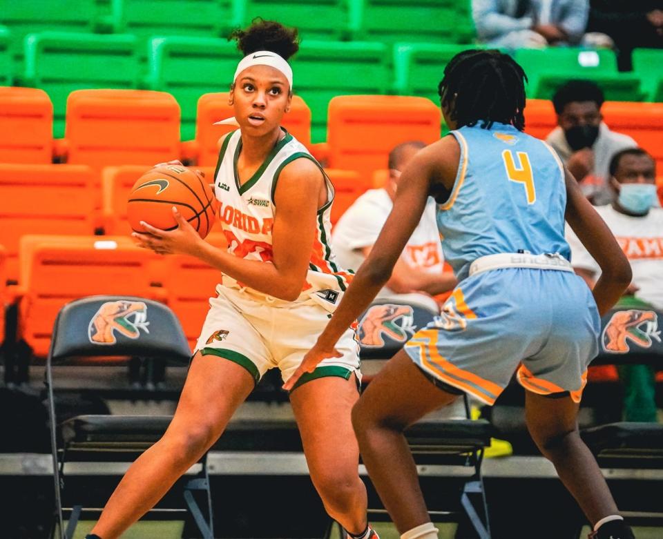 FAMU's Dylan Horton loos to drive by Aleighyah Fontenot of Southern. The Rattlers lost to the Jaguars 71-55 on Saturday, Jan. 8, 2022.