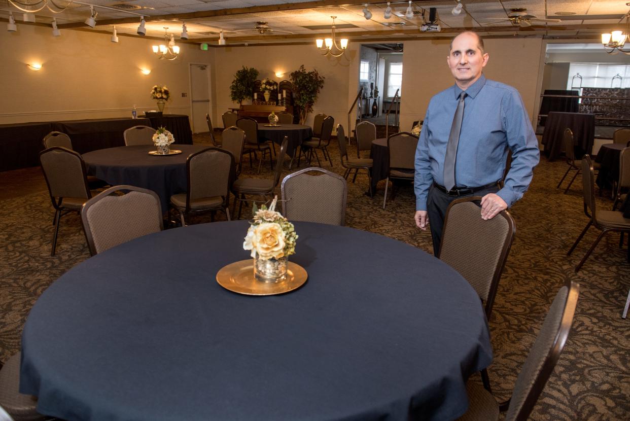 Jim Barrack, head of Barracks Hospitality Group, stands in the empty banquet hall of Barrack’s Cater Inn on Pioneer Parkway in Peoria. The move to Phase 4 for Region 2 will allow Barrack to move forward with plans for small events in the banquet rooms.