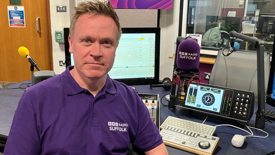 Graeme Mac sitting in a BBC Suffolk radio studio.