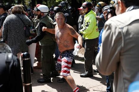 A conservative demonstrator gestures at a Patriots Day Free Speech Rally in Berkeley, California, U.S., April 15, 2017. REUTERS/Stephen Lam