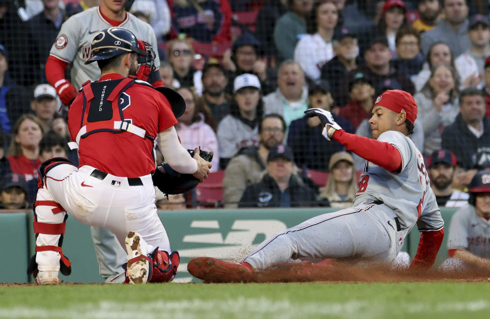 Boston Red Sox catcher Connor Wong, left, tags out Washington Nationals' Trey Lipscomb during the second inning of a baseball game Friday, May 10, 2024, in Boston. (AP Photo/Mark Stockwell)
