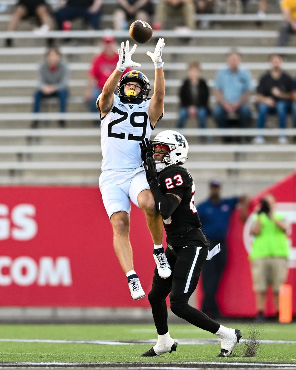 West Virginia wide receiver Preston Fox (29) catches a pass against Houston.