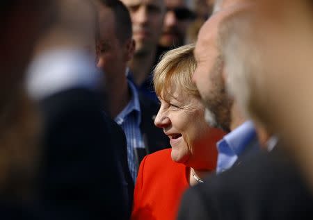 German Chancellor Angela Merkel, a top candidate of the Christian Democratic Union Party (CDU), attends an election rally ahead of the upcoming federal election in Sankt Peter-Ording, Germany, August 21, 2017. REUTERS/Morris Mac Matzen
