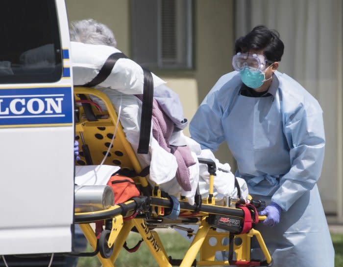 A patient is moved out of Gateway Care & Rehabillition Center, a skilled nursing facility in Hayward, California on Thursday, April 9, 2020.  Thirty-five patients have tested positive for COVID-19 along with 24 staffers. Six patients have died.  Photo by Terry Schmitt/UPI