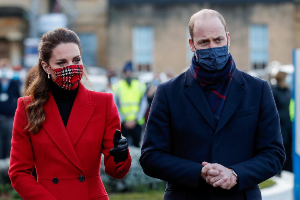 Wearing protective face coverings to combat the spread of the coronavirus, Britain's Prince William, Duke of Cambridge (R) and Britain's Catherine, Duchess of Cambridge, meet NHS (National Health Service) staff during a visit to the Royal Berkshire Hospital in Reading,  west of London to pass on their thanks on behalf of the nation for their work during the COVID-19 pandemic, on December 8, 2020, on the final day of engagements on their tour of the UK. - During their trip, their Royal Highnesses hope to pay tribute to individuals, organisations and initiatives across the country that have gone above and beyond to support their local communities this year. (Photo by MATTHEW CHILDS / POOL / AFP) (Photo by MATTHEW CHILDS/POOL/AFP via Getty Images)