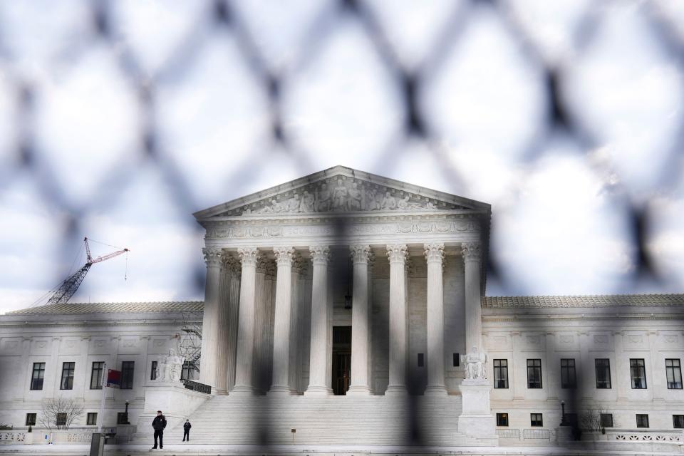 The U.S. Supreme Court is seen through the perimeter fence, in Washington, Monday, Feb. 6, 2023, ahead of the Tuesday evening State of the Union address. (AP Photo/Mariam Zuhaib) ORG XMIT: DCMZ305