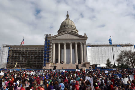 Teachers rally outside of the state Capitol on the second day of a teacher walkout to demand higher pay and more funding for education in Oklahoma City, Oklahoma, U.S., April 3, 2018. REUTERS/Nick Oxford