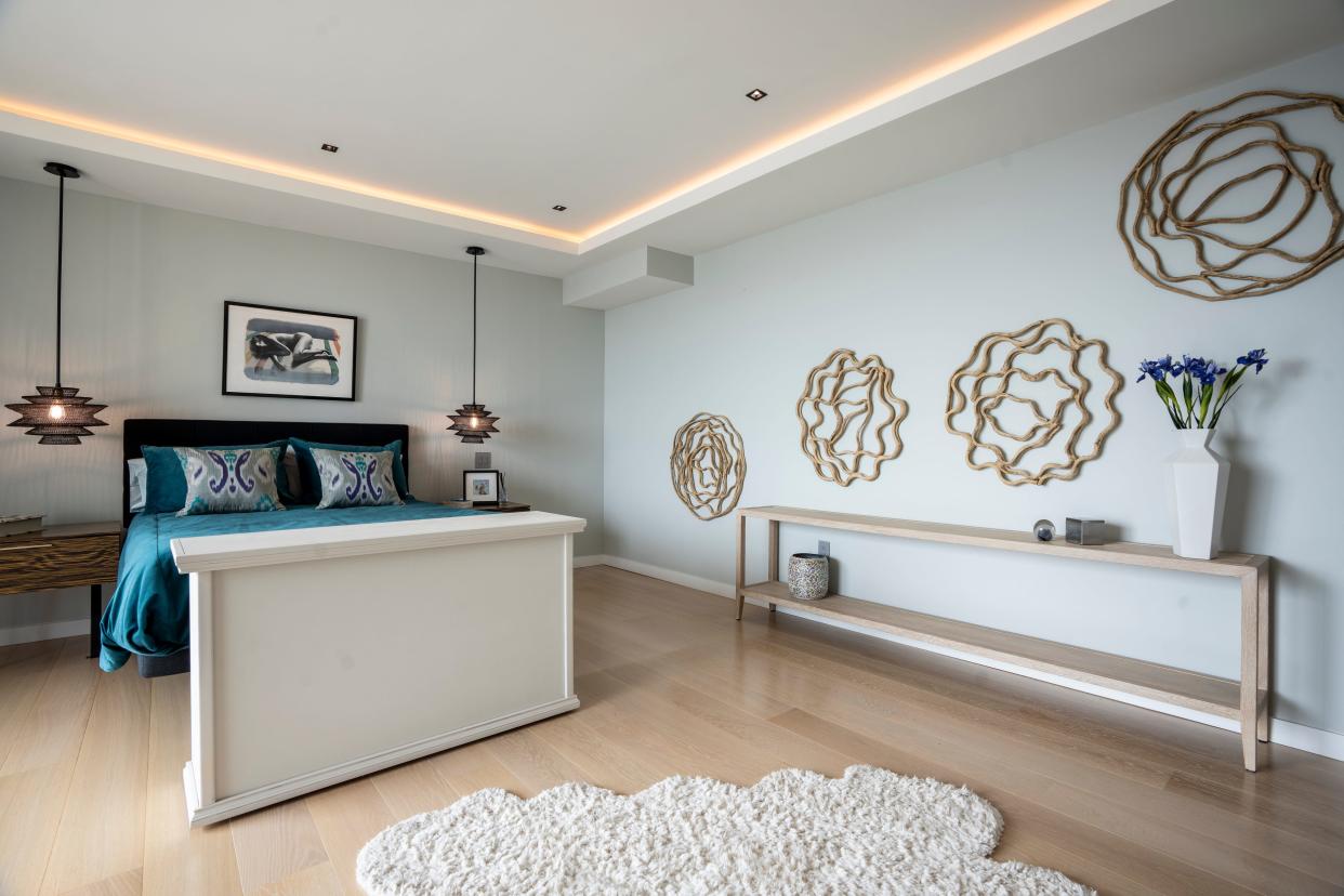 The primary bedroom of a penthouse in Fort Lee.