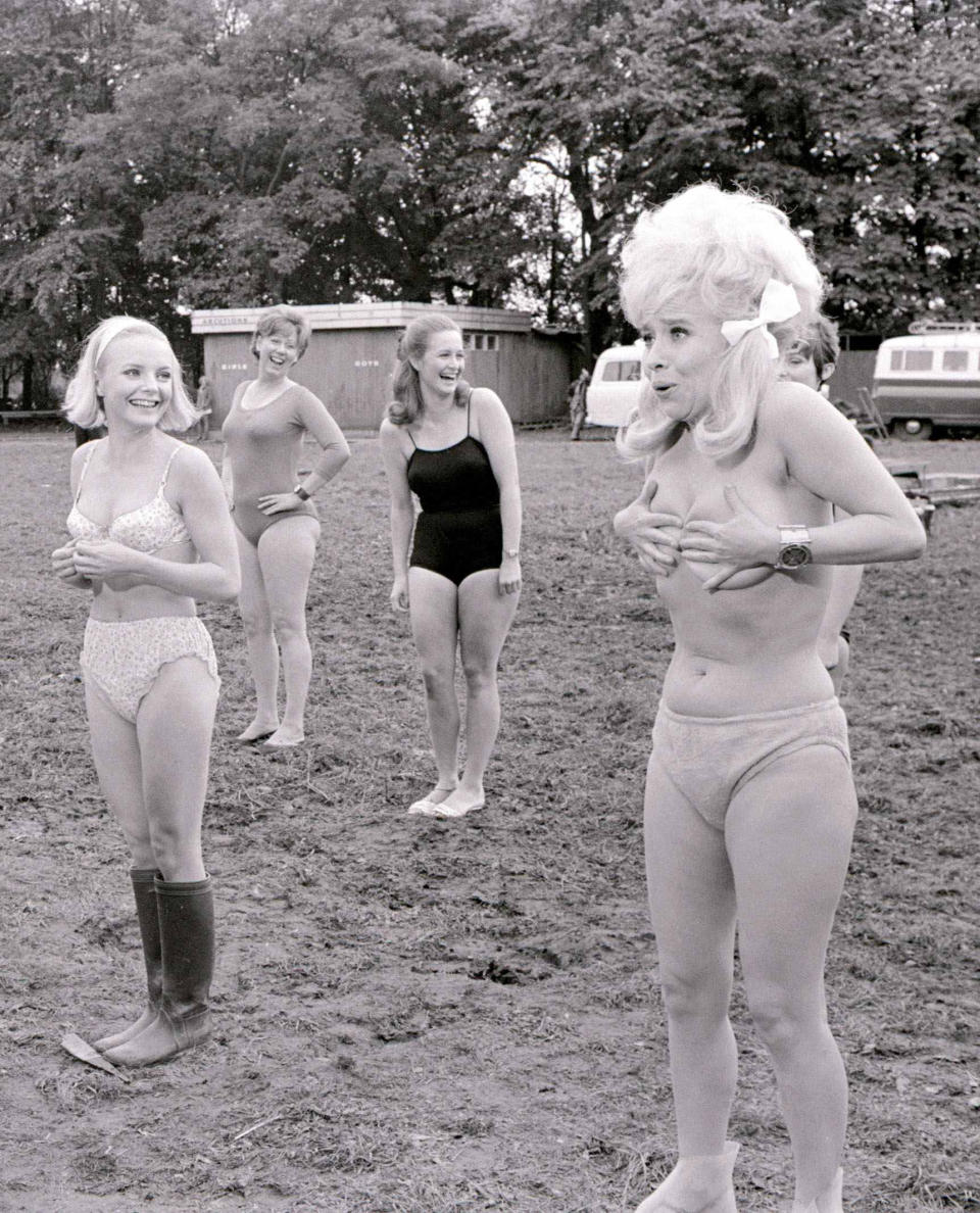 The filming of the sequence was at Pinewood Studio's. Actress Elizabeth Knight wearing wellington boots laughs as Barbara loses her bra. ©Mirrorpix (Photo by Crawshaw/Mirrorpix/Mirrorpix via Getty Images)