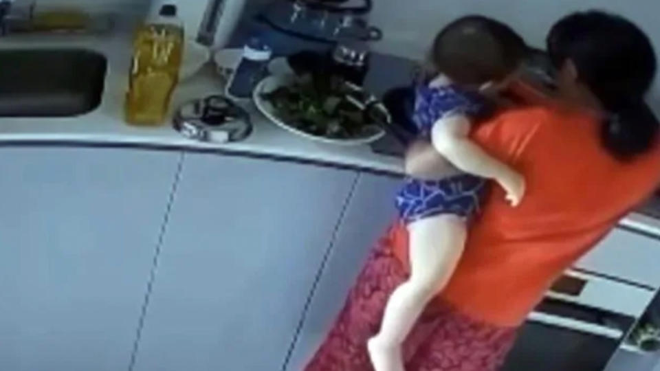 A housekeeper has been accused of putting a toddler's arm in boiling water in Singapore.