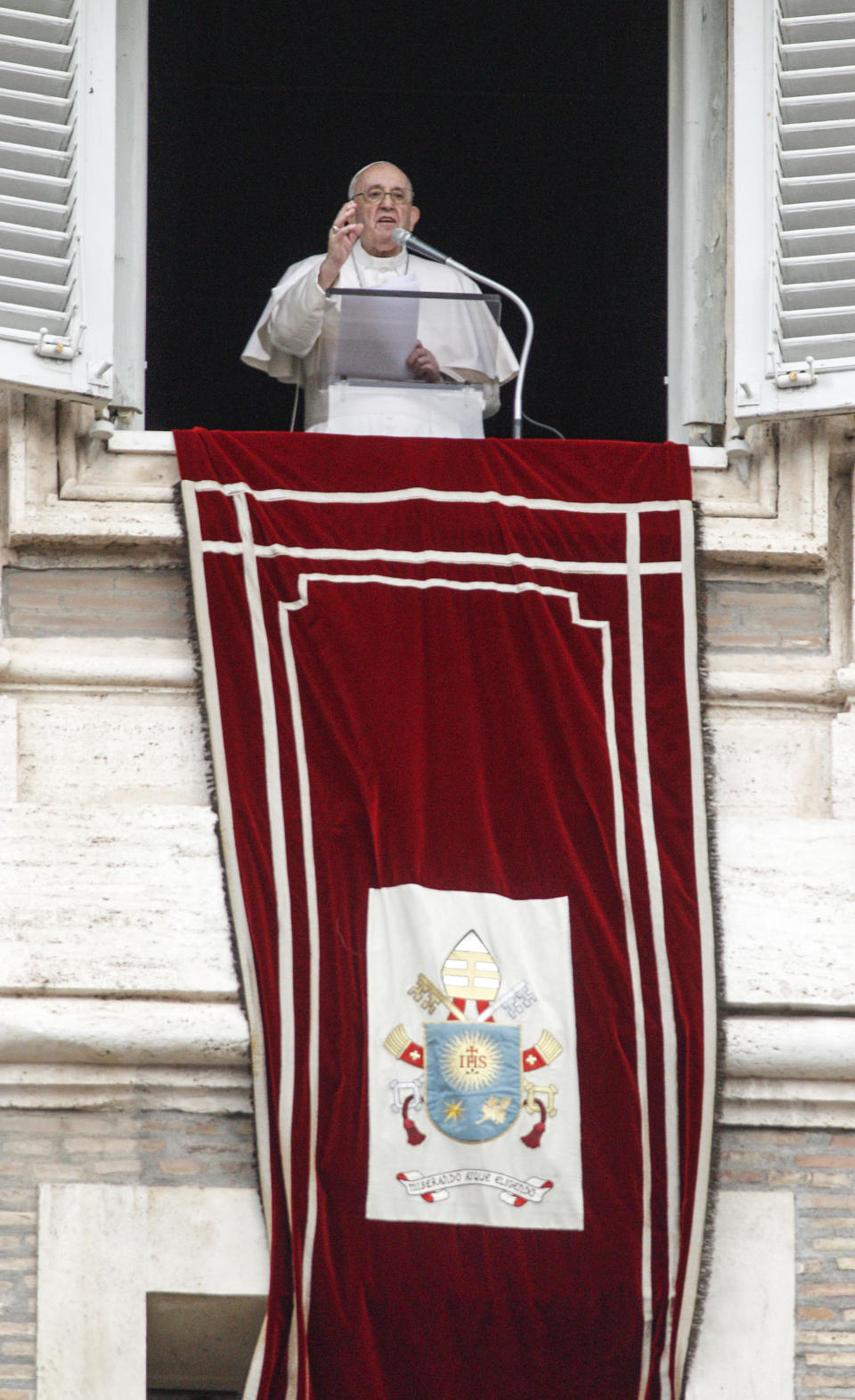 Pope Francis looks from his studio window overlooking St. Peter's Square to celebrate the Angelus prayer, at the Vatican, Sunday, July 25, 2021. Pope Francis has offered his blessing for the Tokyo Olympic Games from Vatican City. Francis told the faithful gathered in St. Peter’s Square for the traditional papal blessing that “in this period of pandemic, these Games are a sign of hope, a sign of universal brotherhood and of a healthy competitive spirit.” (AP Photo/Riccardo De Luca)