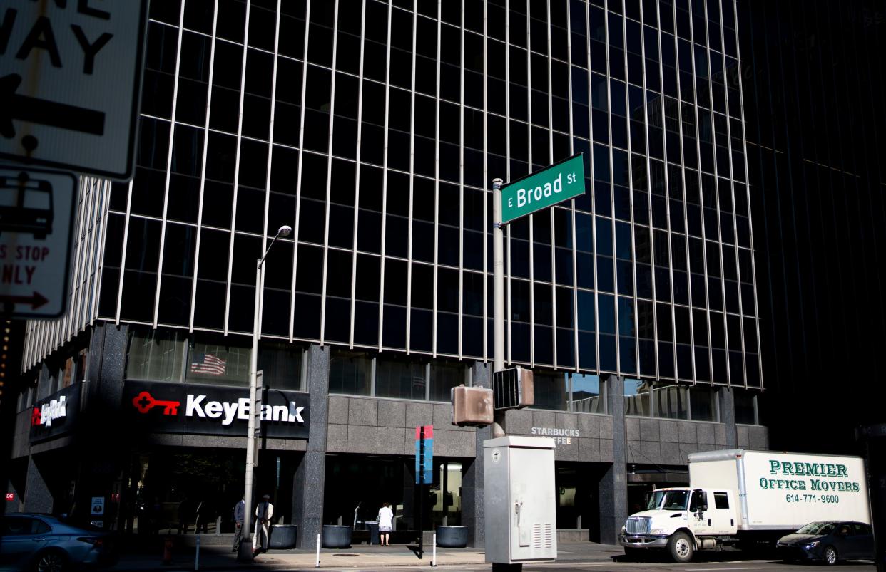 Movers haul office equipment out of the Key Bank building on Tuesday in downtown Columbus. Several tenants said they are leaving the building after concerns over how it is being managed.