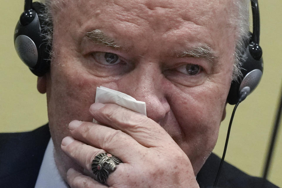 Former Bosnian Serb military chief Ratko Mladic sits in the court room in The Hague, Netherlands, Tuesday, June 8, 2021, where the United Nations court delivers its verdict in the appeal of Mladic against his convictions for genocide and other crimes and his life sentence for masterminding atrocities throughout the Bosnian war. (AP Photo/Peter Dejong, Pool)