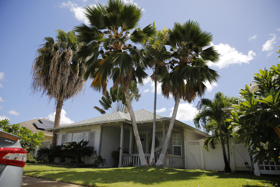 FILE - The home where U.S. defense contractor Walter Glenn Primrose and his wife, Gwynn Darlle Morrison, lived for years allegedly under aliases, is pictured, Wednesday, July 27, 2022, in Kapolei, Hawaii. U.S. prosecutors who introduced Russian spy intrigue into the case of the couple accused of living for decades in Hawaii under identities stolen from dead babies are now saying they don't want jurors to hear about photographs showing them wearing foreign uniforms. A U.S. judge granted the request, ruling that the uniforms are not relevant to the upcoming trial for charges involving identity theft and passport fraud. (AP Photo/Caleb Jones, File)