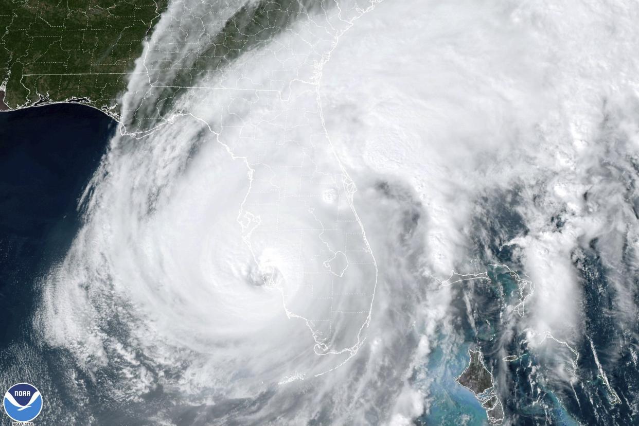 This satellite image taken at 3:06 p.m. EDT and provided by NOAA shows Hurricane Ian making landfall in southwest Florida near Cayo Costa, Fla., on Wednesday, Sept. 28, 2022, as a catastrophic Category 4 storm. 